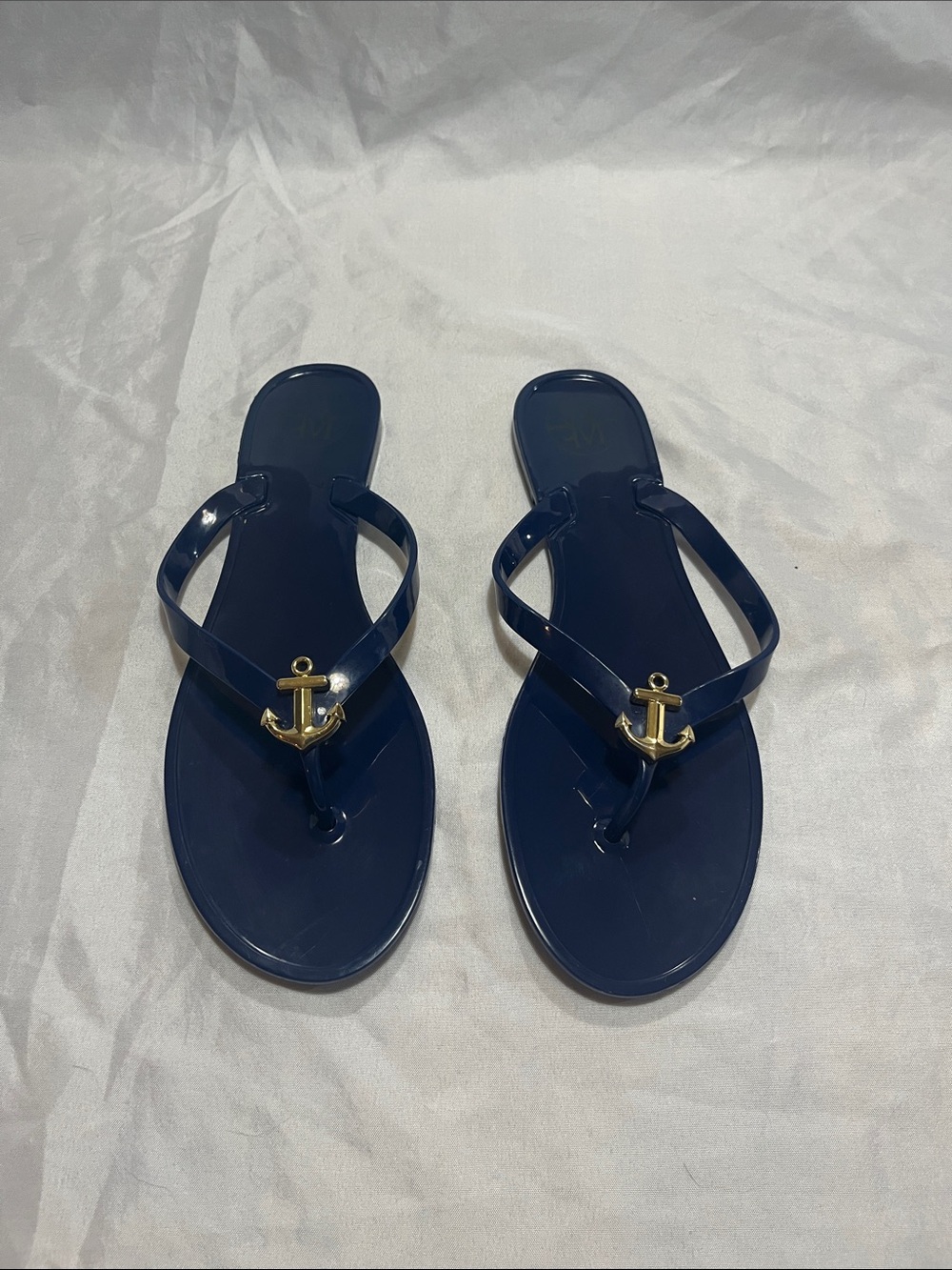 Tory Burch Navy Jelly Flip Flops with Gold Anchor Accent